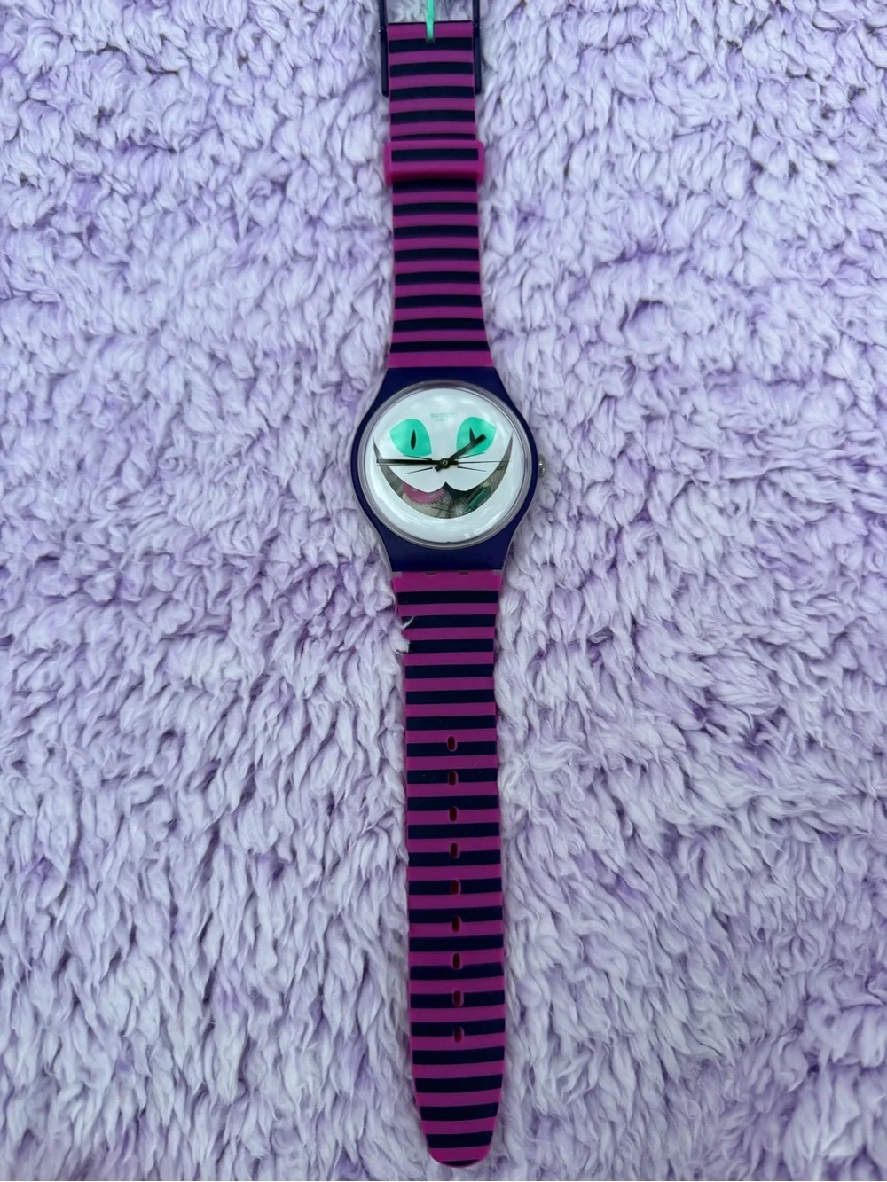Swatch Cheshire Cat face watch